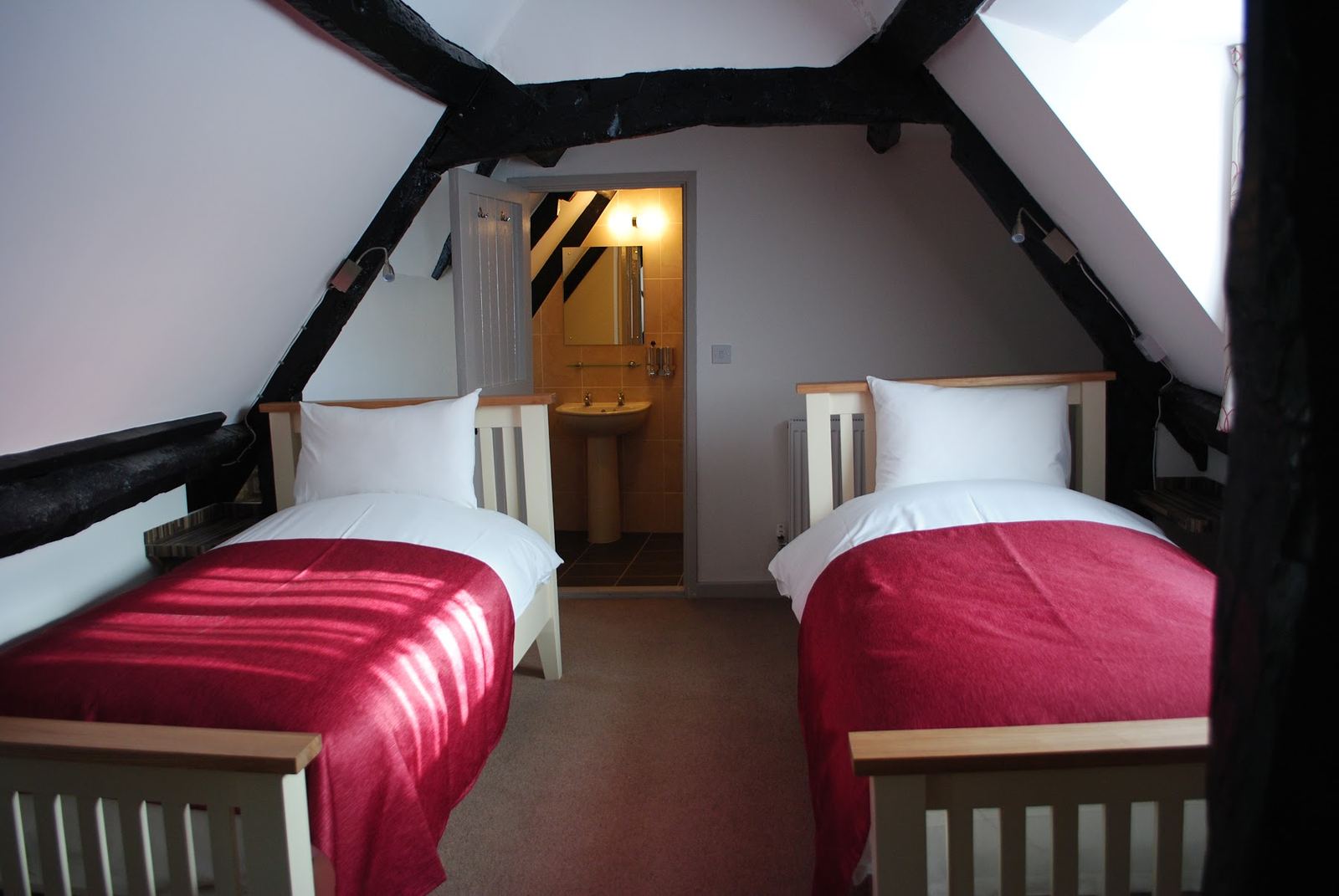 A twin room under the beams at The Blenheim Buttery